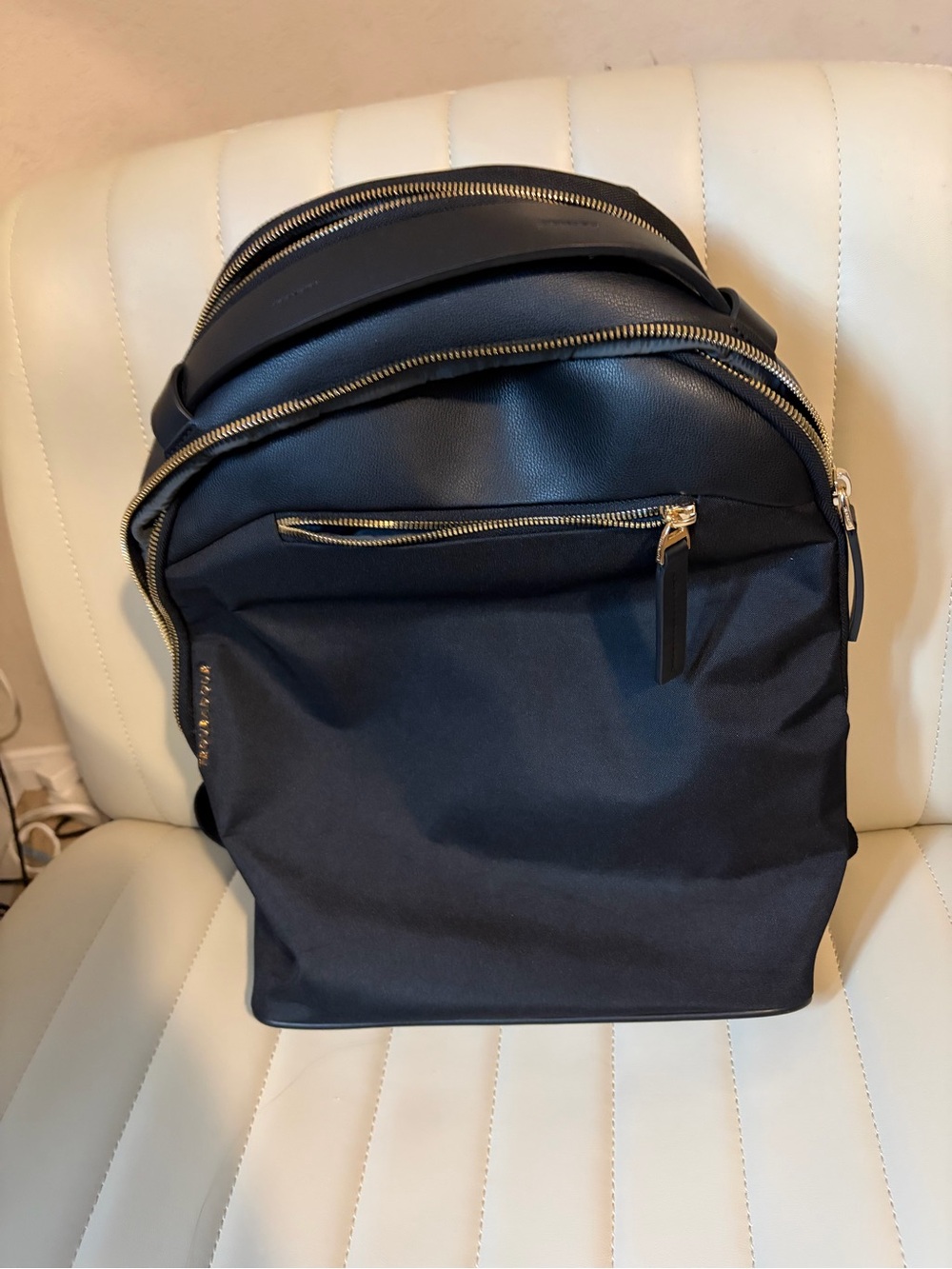 Sophisticated Black Women's Backpack with Gold Hardware